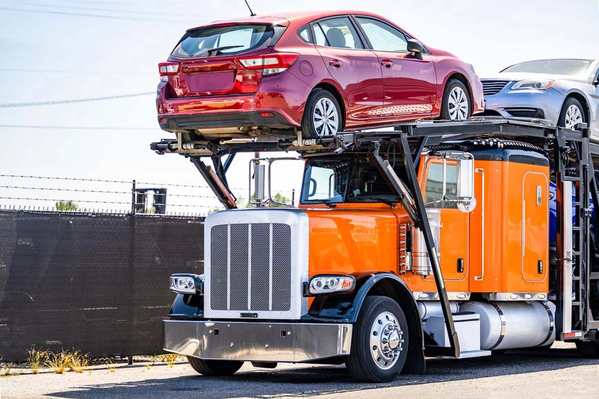 Car carrier loaded with vehicles for snowbird season auto transport