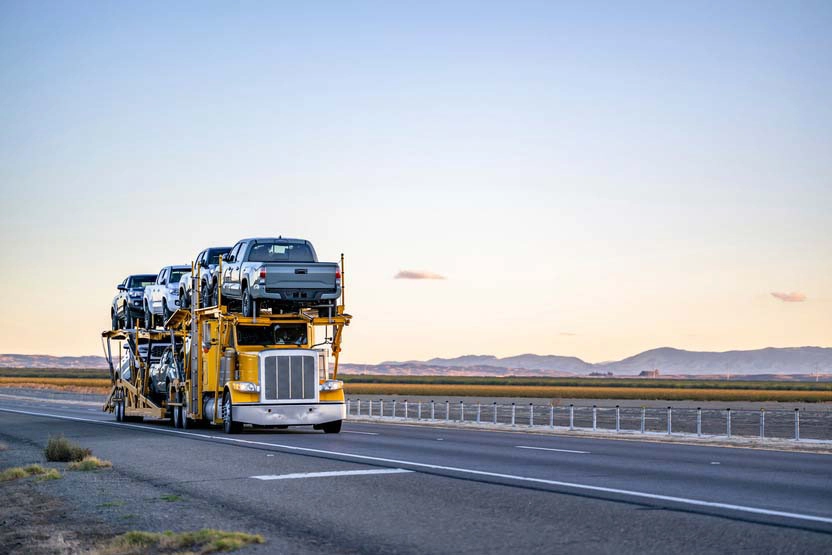 Car carrier driving down the highway on an expedited auto transport route