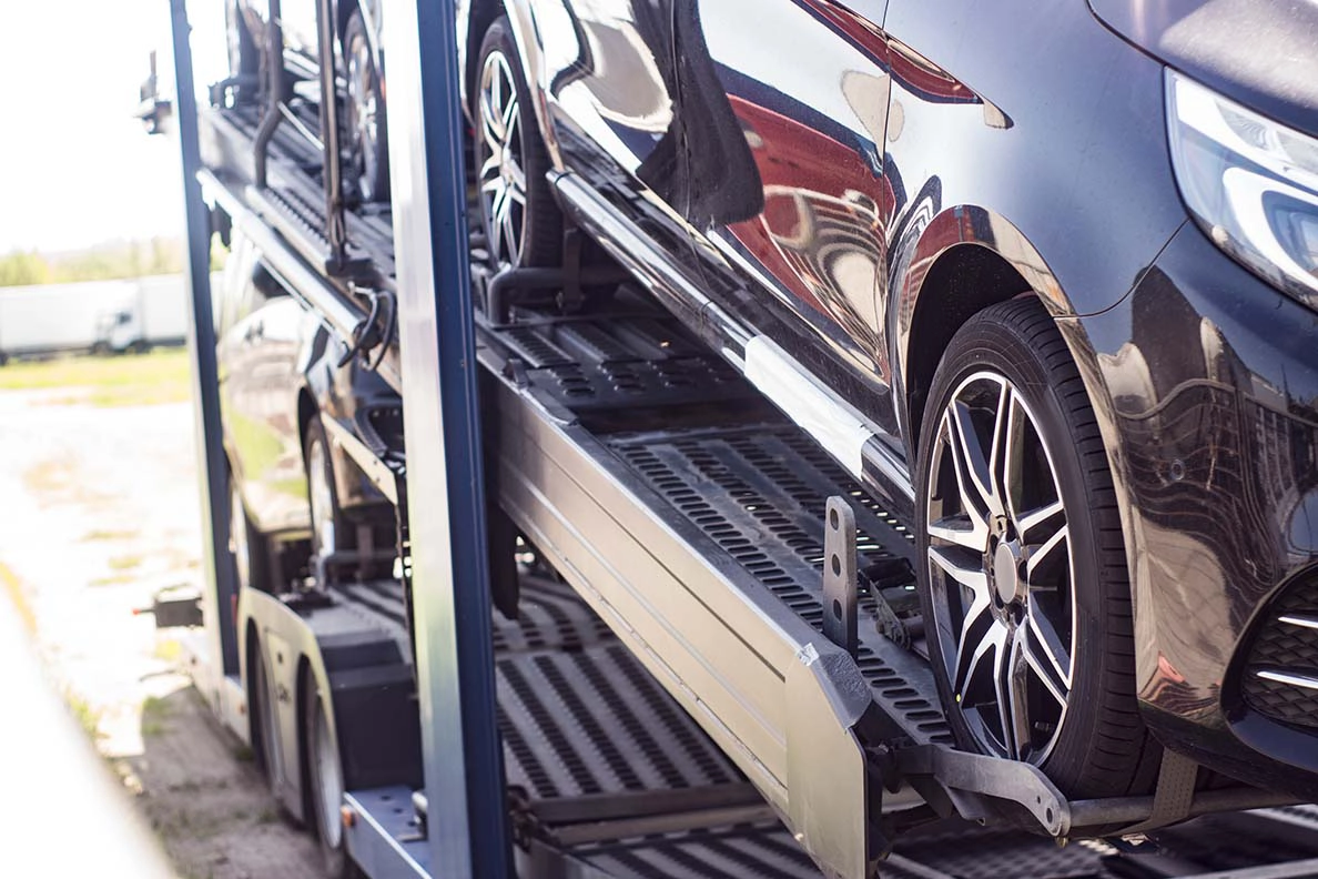 Vehicle secured on a car carrier trailer for Delaware auto transport